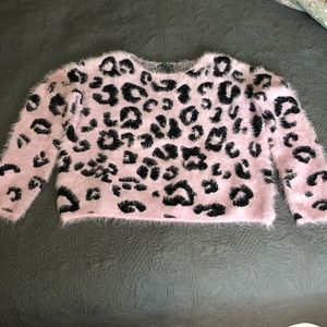 Pink animal print sweater.